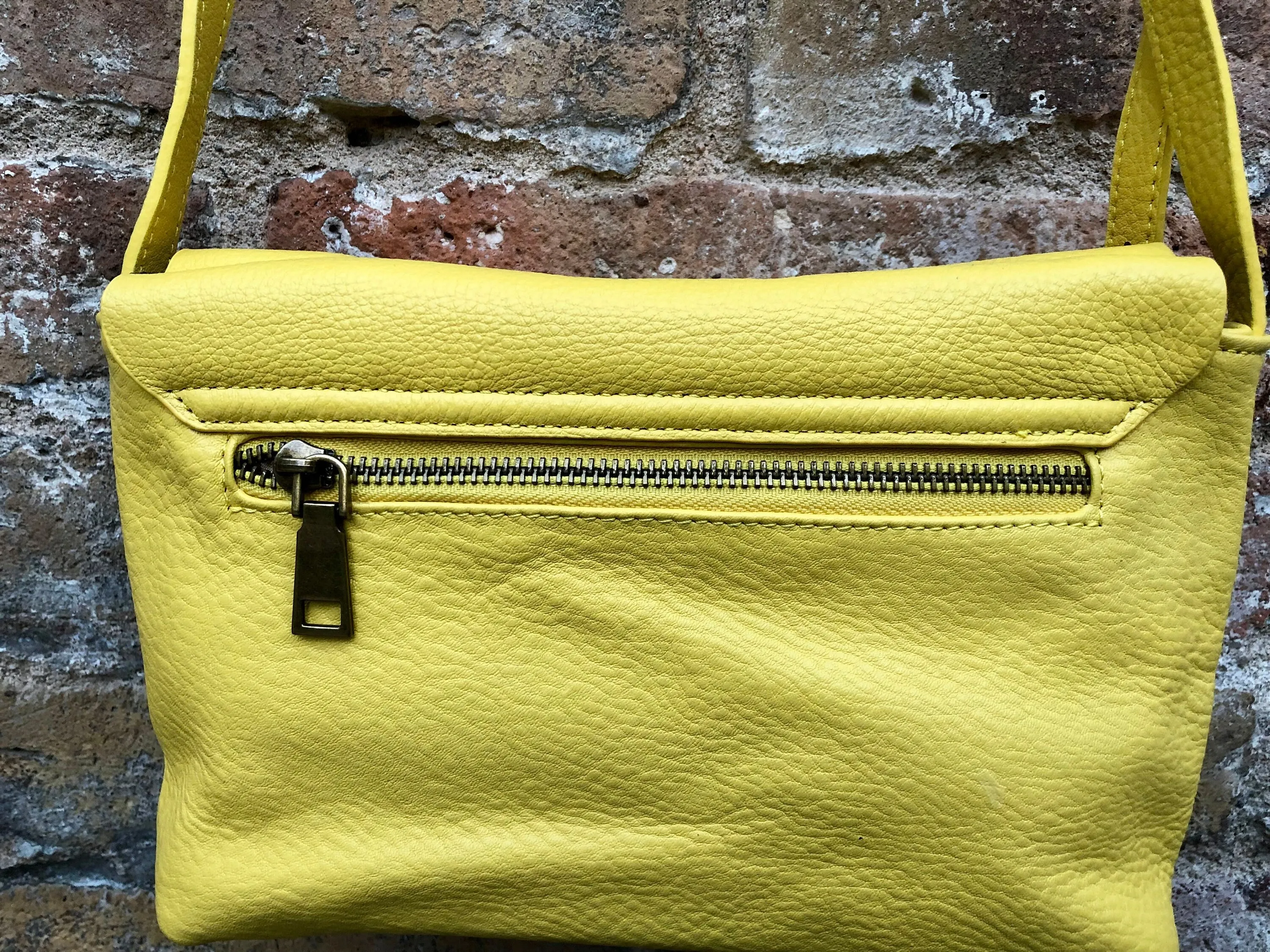 Small leather bag in yellow. Cross body or shoulder bag in GENUINE leather. Yellow leather bag with adjustable strap,  zipper and flap.