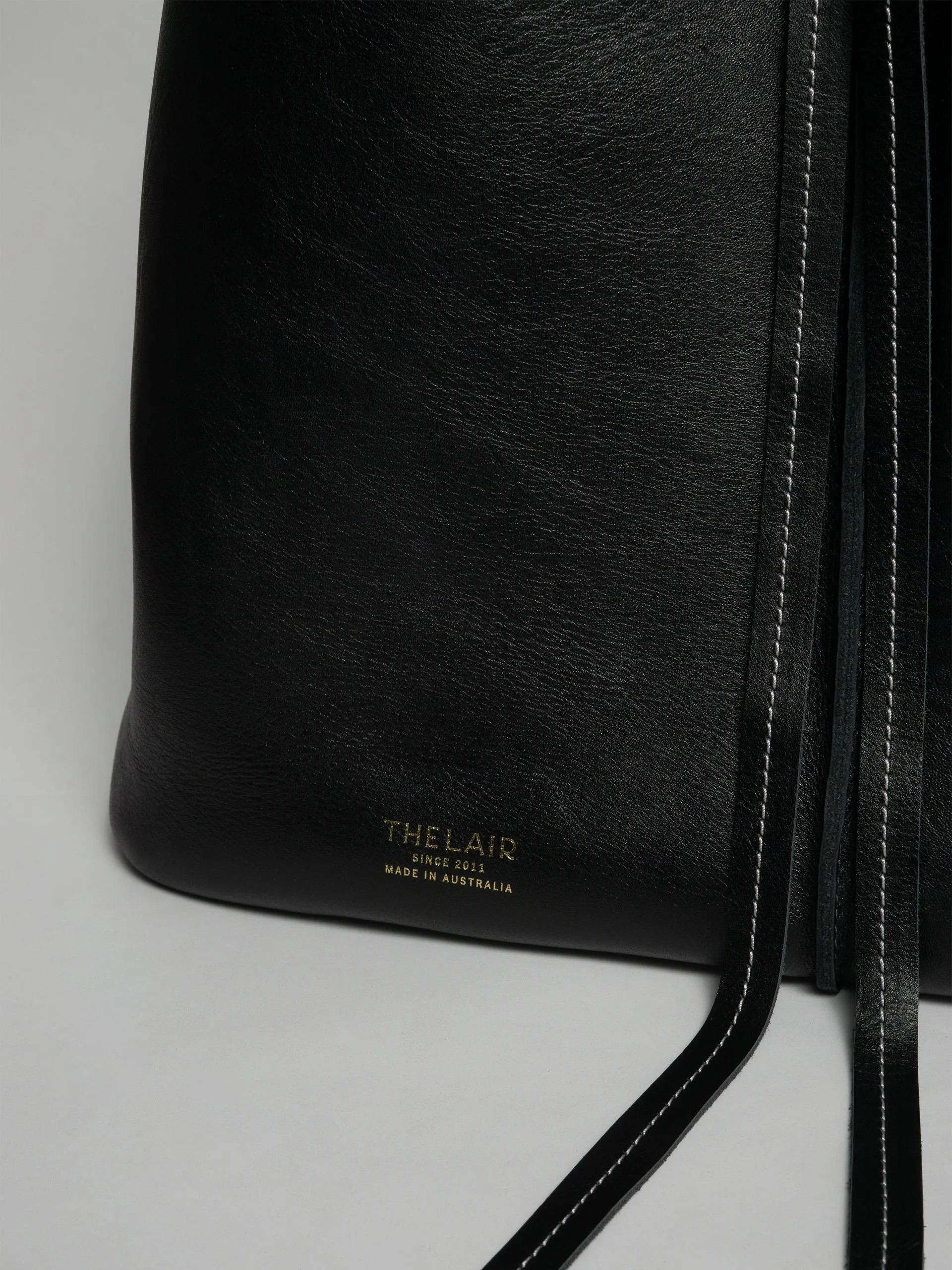 The Lair Suedo Sling Bag Large Black Gold