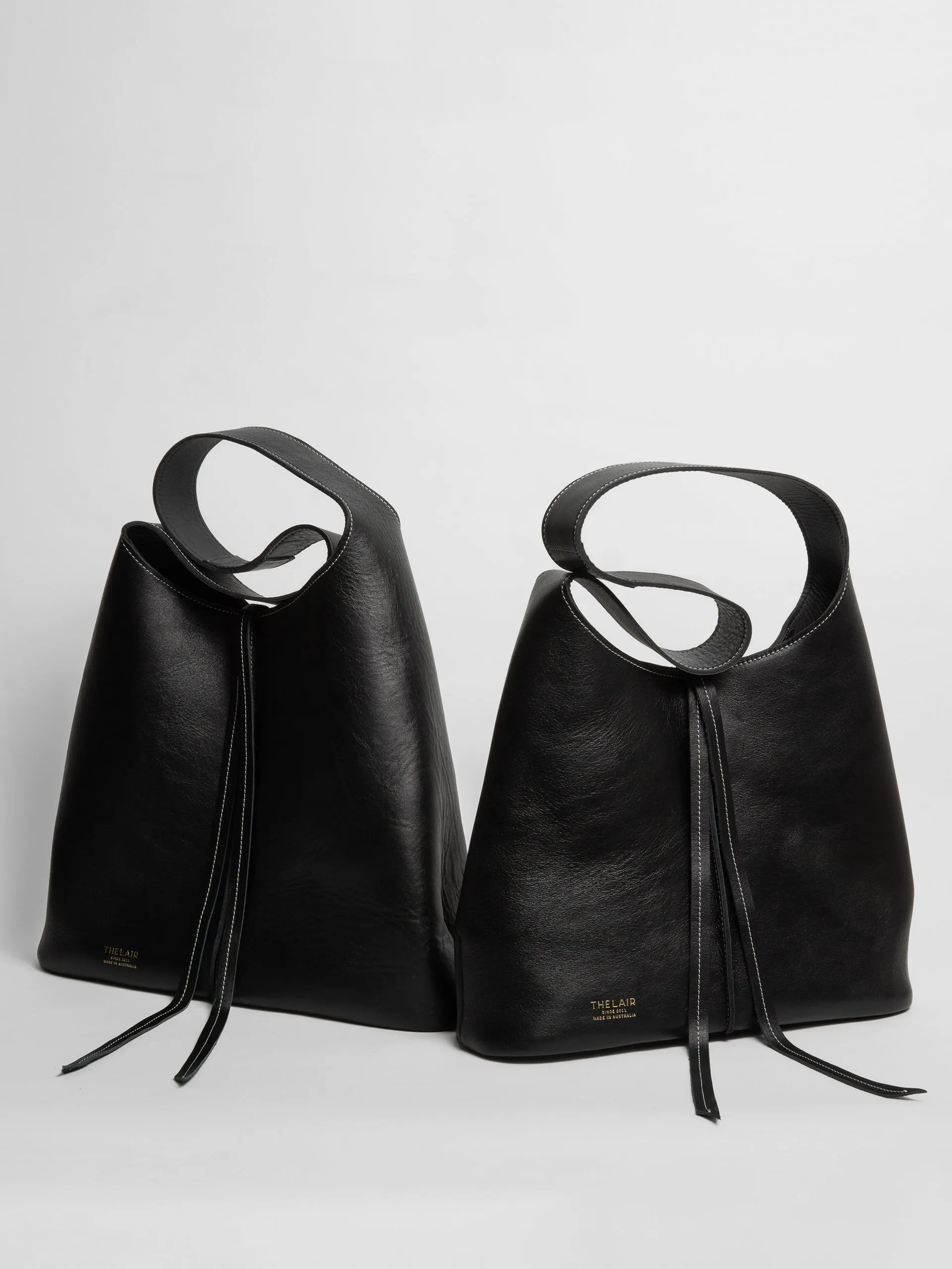 The Lair Suedo Sling Bag Large Black Gold