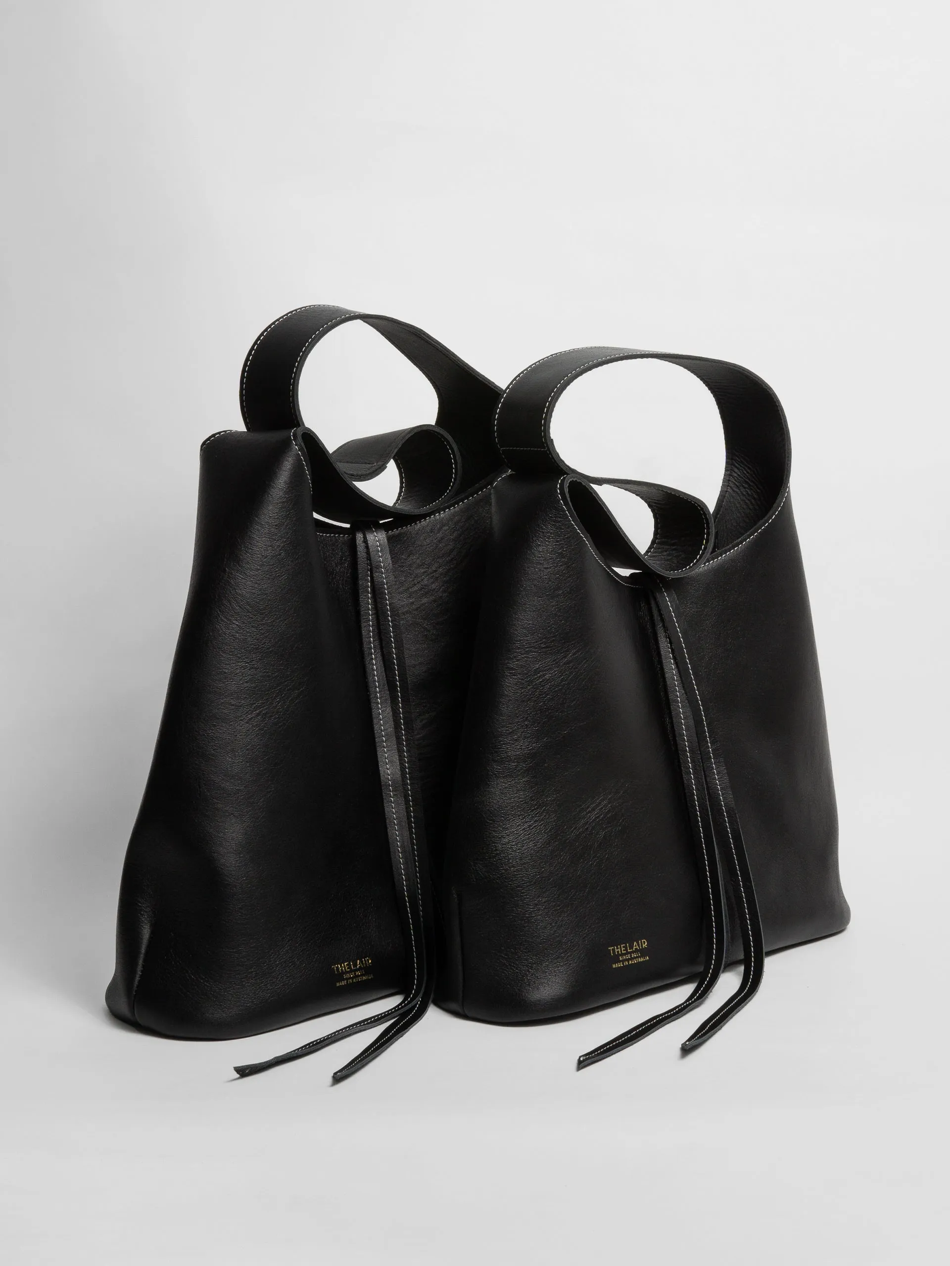 The Lair Suedo Sling Bag Large Black Gold