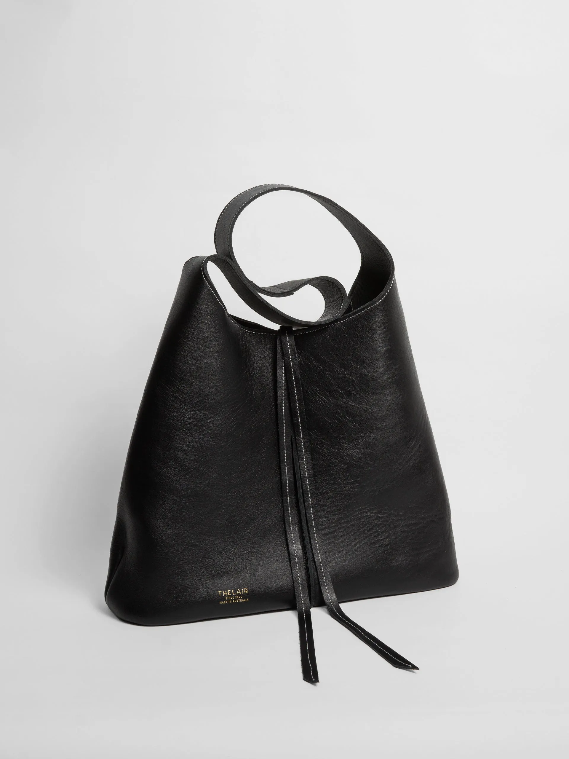 The Lair Suedo Sling Bag Large Black Gold