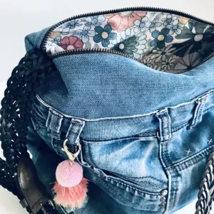Upcycled denim hobo bag with retro floral print and braided strap